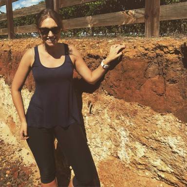 Melanie with the Terra Rossa soil in Coonawarra